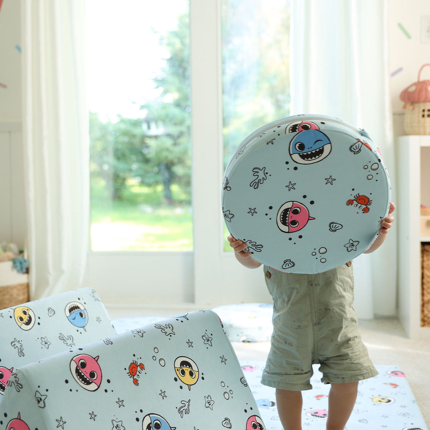 Toddler holding Baby Shark™ x Roo & You™ Stepping Stones, modular foam play set for kids.