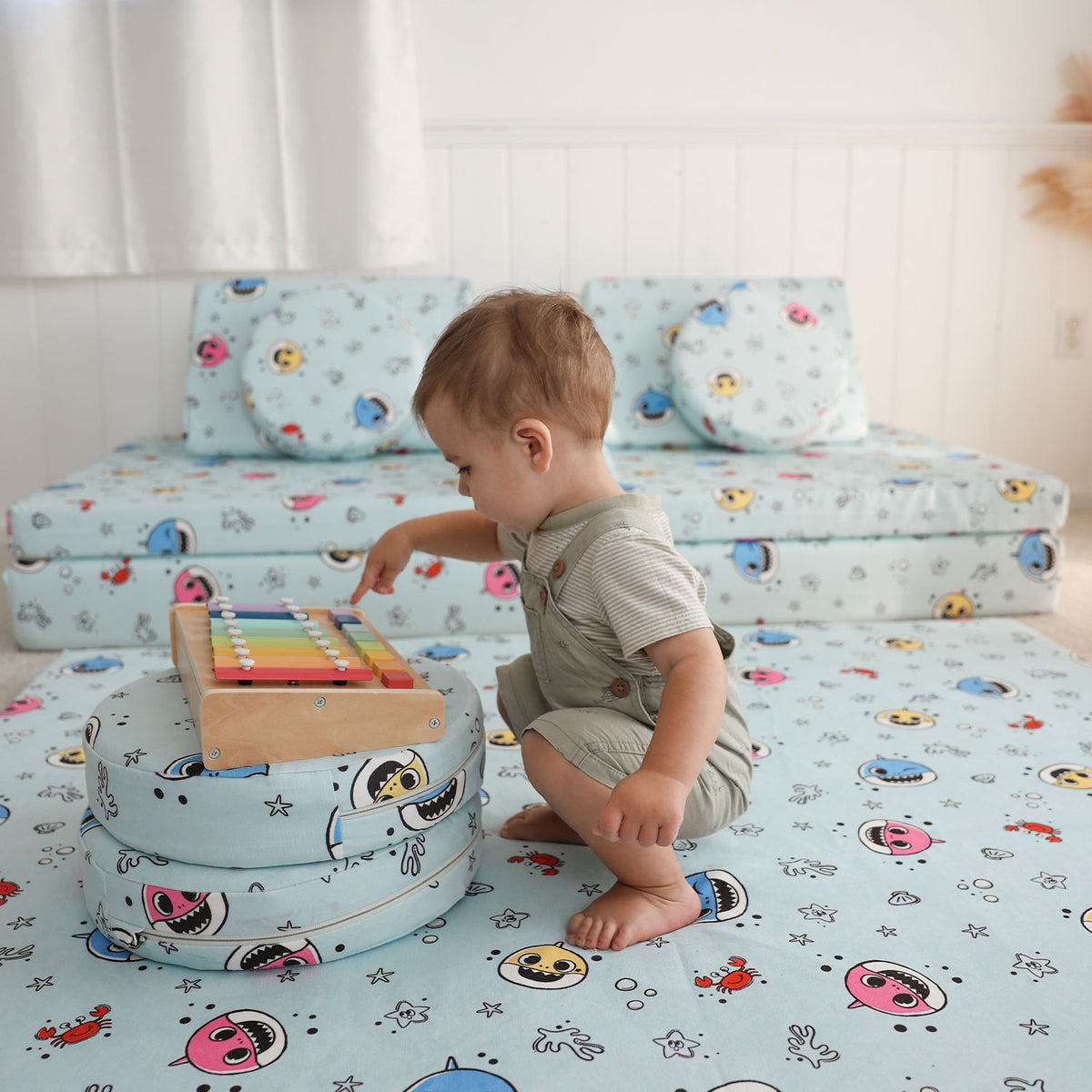 Toddler playing with Baby Shark™ x Roo & You™ Stepping Stones, soft foam balance toys for kids.
