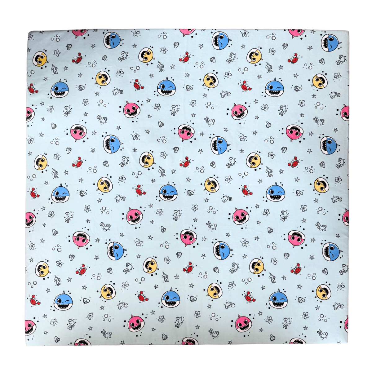 Flat lay of the Baby Shark™ x Roo & You™ Play Mat fabric with colorful characters.