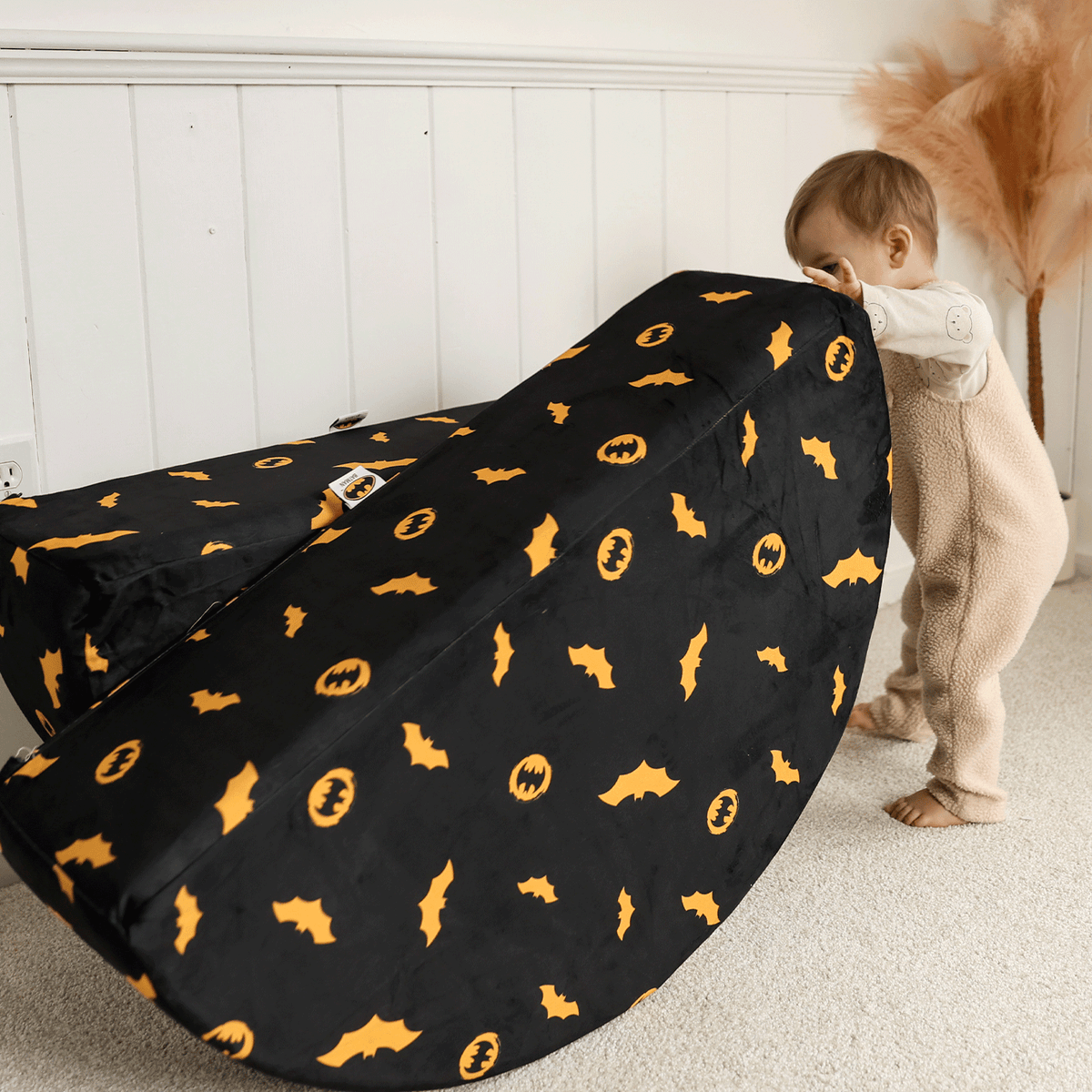 Child playing with Batman™ x Roo & You™ Rocker Set