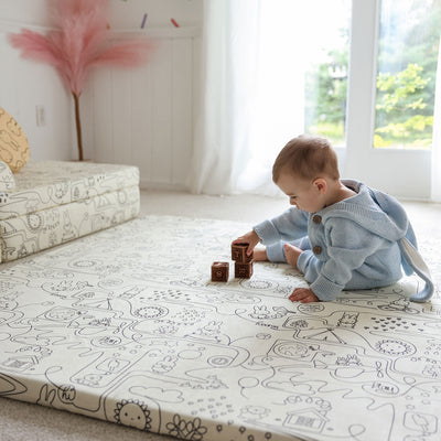 Baby playing on Miffy™ x Roo & You™ Play Mat Cover Set